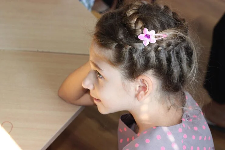 side view girl with braided hair leaning table 1048944 4048555